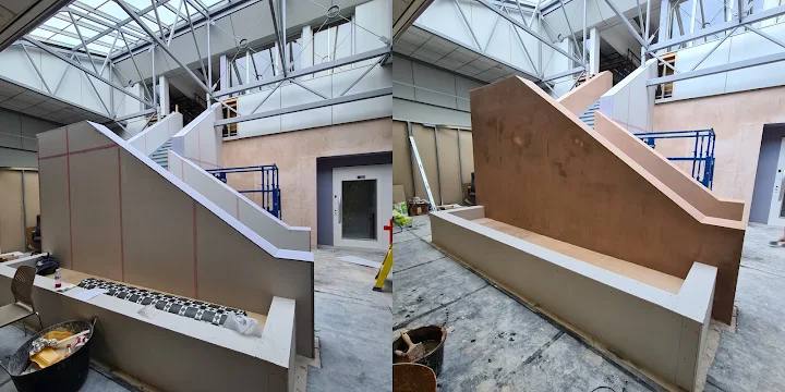 A commercial stairwell with rendering work in progress on the left and the finished rendered stair enclosure on the right.